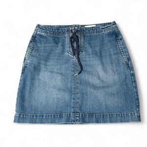 Ann Taylor blue denim skirt with lace up detail and pockets.